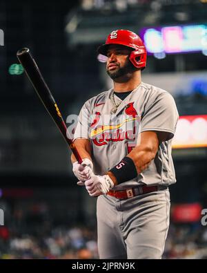 ST. LOUIS, MO - MAY 15: St. Louis Cardinals left fielder Juan Yepez (36)  gives St. Louis Cardinals designated hitter Albert Pujols (5) for pitching  the final three outs of the game