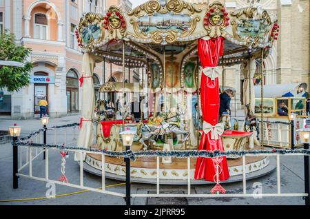 Novi Sad, Serbia - December 13. 2019: Downtown Novi Sad. The decorations on the children's carousel with wooden horses Stock Photo