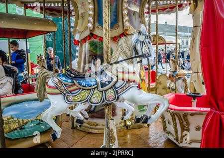 Novi Sad, Serbia - December 13. 2019: Downtown Novi Sad. The decorations on the children's carousel with wooden horses Stock Photo