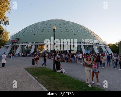 Guests wait outside the Super Bock Arena (Rosa Mota Pavilion) in Crystal Palace Gardens (Jardins do Palácio de Cristal), Porto, Portugal. Stock Photo