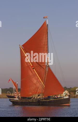 The Thames Sailing Barge Centaur in full sail in the early morning sun on the Blackwater Estuary, Essex. Stock Photo