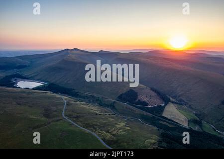 Sunrise over Lakes and Mountains from a drone, Pen y Fan, Cribyn, Brecon Beacons, Wales, England Stock Photo