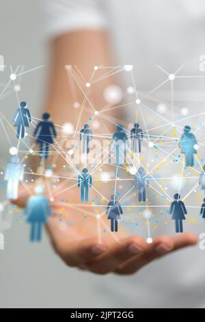 3D rendered people icons hovering over a person's hand Stock Photo - Alamy