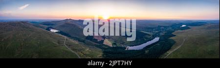 Sunrise over Lakes and Mountains from a drone, Pen y Fan, Cribyn, Brecon Beacons, Wales, England Stock Photo