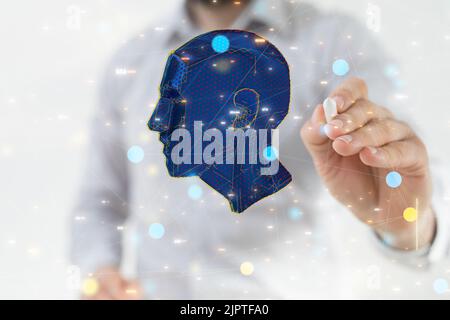 A man's hand pressing an illustrative human head with a digital pen against a white background Stock Photo