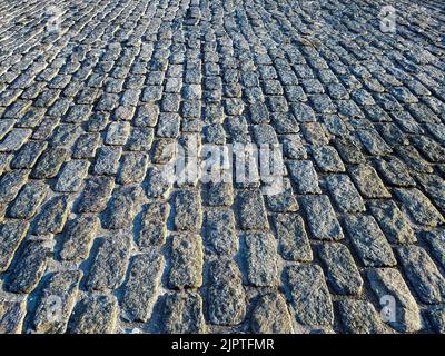 Overhead view of an old cobblestone street in New York City NYC Stock Photo