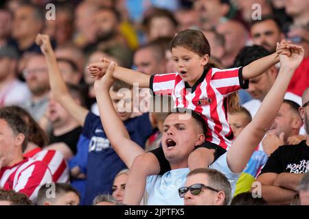 Sunderland fans greet their side on the pitch Stock Photo