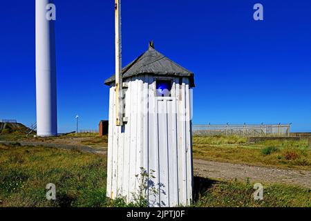 Cambois port Blyth Northumberland old port entry blue navigation line up lights in an old wooden hut still in use against deep blue sky Stock Photo