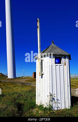 Cambois port Blyth Northumberland old port entry blue navigation line up lights in an old wooden hut still in use against deep blue sky Stock Photo