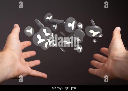 The 3d rendered profile icons hovering over a man's hands Stock Photo