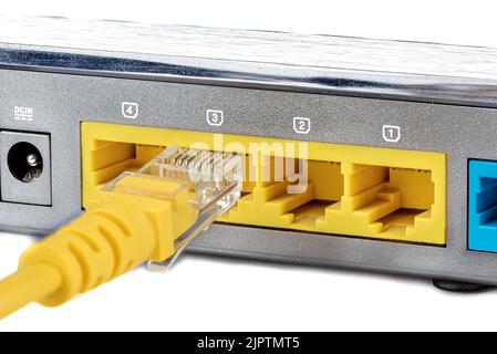 Connecting an Ethernet RJ45 cable to the LAN port. LAN network and Internet connection. Router and access point Wi-Fi. Stock Photo