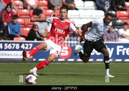 Fleetwood Town's Joshua Earl (left) and Derby County's Nathaniel Mendez-Laing battle for the ball during the Sky Bet League One match at Highbury Stadium, Fleetwood. Picture date: Saturday August 20, 2022. Stock Photo