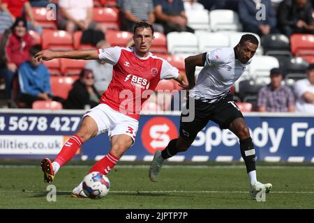 Fleetwood Town's Joshua Earl (left) and Derby County's Nathaniel Mendez-Laing battle for the ball during the Sky Bet League One match at Highbury Stadium, Fleetwood. Picture date: Saturday August 20, 2022. Stock Photo