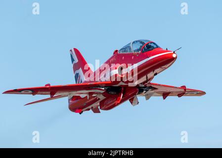 London Southend Airport, Essex, UK. 20th Aug, 2022. The RAF’s Red Arrows are using the civilian airport to operate from for this weekend’s airshows at Eastbourne and Folkestone. A Red Arrows BAe Hawk T1 jet plane climbing away after take off Stock Photo
