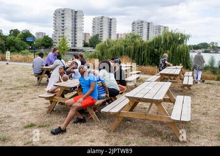London, UK.  20 August 2022. Local visitors at the Thamesmead Festival in south east London.  Organised by a dedicated group of residents, it is the flagship community event each summer, showcasing singers, musicians and other creative home-grown Thamesmead talent.  Credit: Stephen Chung / Alamy Live News Stock Photo