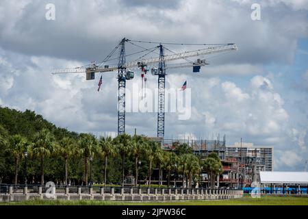 Charleston, SC - Aug 7 2022: Two Cranes constructed near Joe Riley Waterfront Park to build a new hotel Stock Photo