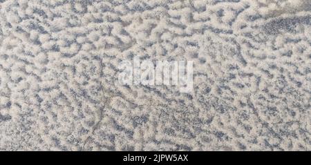 abstract winter background: frost patterns on the ground Stock Photo