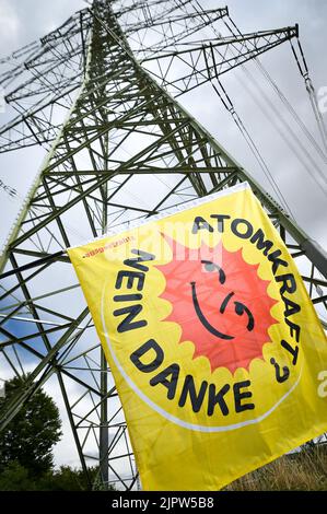 Neckarwestheim, Germany. 20th Aug, 2022. Anti-nuclear activists demonstrate near the nuclear power plant. The demonstration takes place as part of a three-week continuous protest, an anti-nuclear bike tour through southern Germany, Switzerland and France. This is to demonstrate for the shutdown of all nuclear power plants. Credit: Ferdinando Iannone/dpa/Alamy Live News Stock Photo