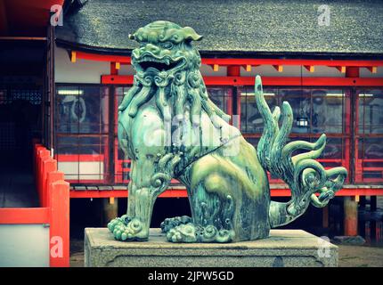 Komainu Lion Dog, guardian statue of Itsukushima Jinja shinto shrine, Miyajima island, Hiroshima Prefecture, Japan. Stock Photo