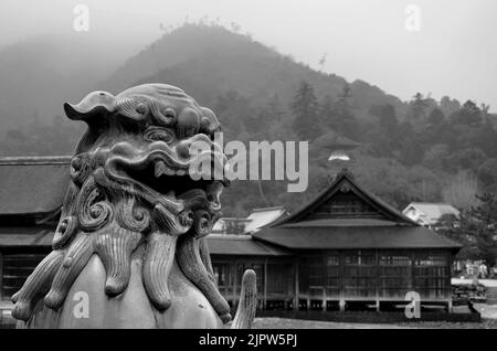 Komainu Lion Dog, guardian statue of Itsukushima Jinja shinto shrine, Miyajima island, Hiroshima Prefecture, Japan. Stock Photo