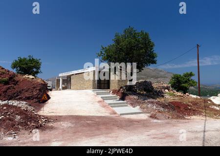 The new Dwarf Elephant Museum at the Charkadio Caves.Tilos, Greece . Men at work. May 2022. Stock Photo