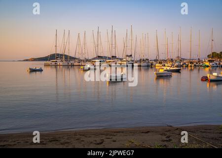 View of boats overlooking Skiathos Town at sunrise, Skiathos Island, Sporades Islands, Greek Islands, Greece, Europe Stock Photo