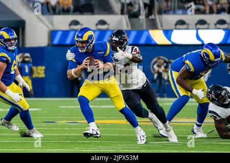 Los Angeles Rams quarterback John Wolford front is tackled by