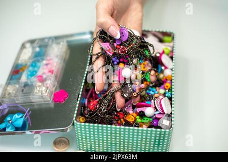 box with sewing accessories, beads and buttons on a white background. Stock Photo