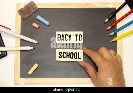 Books on the background of the school board. Stock Photo