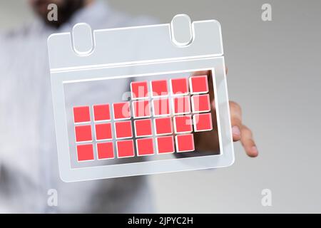 A man's hand touching a floating 3D calendar Stock Photo