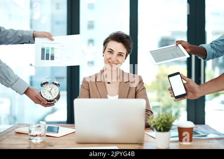 I feel more creative when Im under the gun. a young businesswoman looking calm in a demanding office environment. Stock Photo