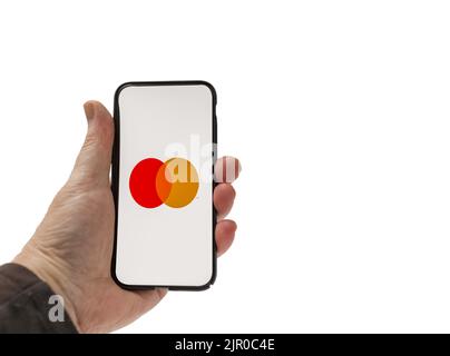 Cardiff Mid Glamorgan UK August 20 2022 person holding cellphone with  Mastercard Logo on a white background Stock Photo