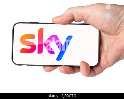Cardiff Mid glamorgan Wales UK  August 20 2022 Person holding mobile phone with logo of Sky Television and digital services on a Cell phone screen Stock Photo