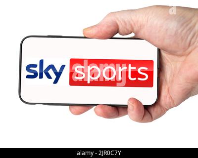 Cardiff Mid glamorgan Wales UK  August 20 2022 Person holding mobile phone with logo of SkySports digital services on a Cell phone screen Stock Photo