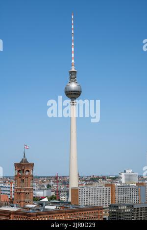 The famous TV Tower and the red town hall in Berlin on a sunny day Stock Photo