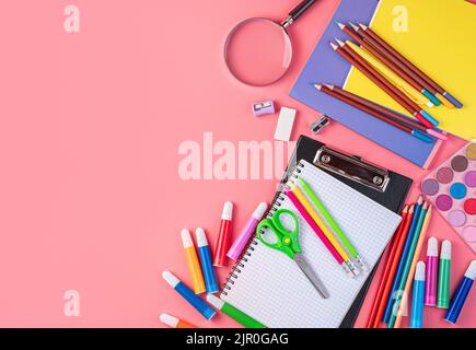 Stationery and school supplies on a pink background with space for copying. Stock Photo