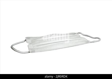 Medical mask isolated on white background with clipping path. Virus protection, pollution, flu, and health care. Stock Photo