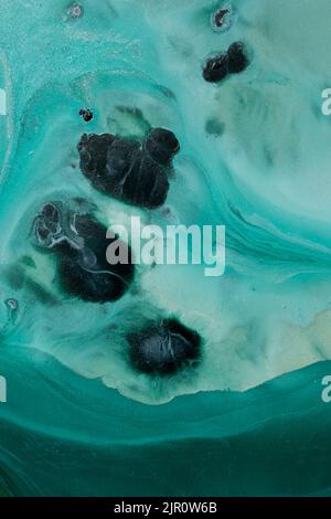 Abstract fluid acrylic painting. Marbled blue abstract background. Hand painted background with mixed liquid blue and green paints. Liquid marble Stock Photo