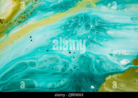 Abstract fluid acrylic painting. Marbled blue abstract background. Hand painted background with mixed liquid blue and green paints. Liquid marble Stock Photo