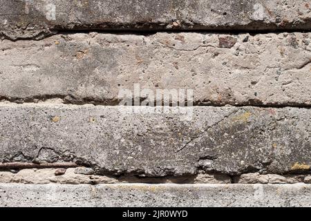 Old concrete blocks wall background closeup. Industrial background Stock Photo