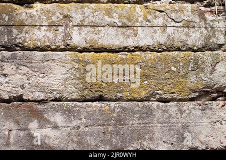 Old concrete blocks wall background closeup. Industrial background Stock Photo