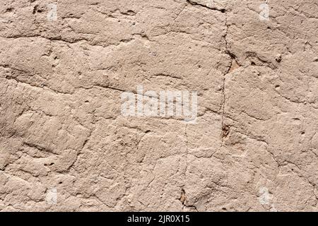 Old cob wall with cracked surface. Vintage background for design purposes Stock Photo