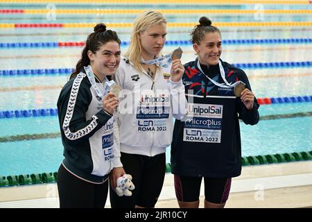 Rome, Italy. 17th Aug, 2022. Rome, 17 August 2022 European Swimming Championships in Rome 2022 in the photo: the podium of the 50 meters breaststroke women: from the left the Italian Benedetta Pilato silver medal, the Lithuanian Ruta Meilutyte gold medal and the English Imogen Clark Rome, August 17, 2022 European Swimming Championships in Rome 2022 Pictured: The podium in the women's 50-meter breaststroke: from left, Italy's Benedetta Pilato silver medalist, Lithuania's Ruta Meilutyte gold medalist and England's Imogen Clark Credit: Independent Photo Agency/Alamy Live News Stock Photo