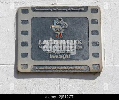 Commemorating the Centenary of Cinema 1996 plaque at Robin Hooh's Bay, North Yorkshire - J.Arhur Rank film Turn of The Tide 1935. Stock Photo