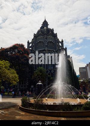 A beautiful shot of the palace of Culture Rafael Uribe Uribe with a front fountain in Medellin Stock Photo