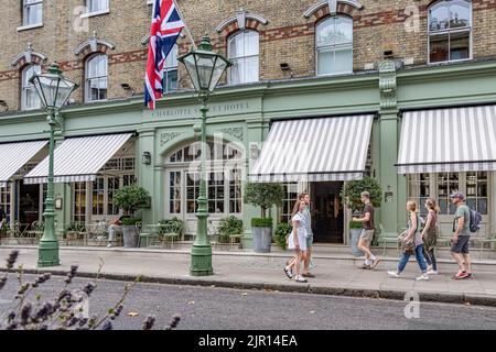 People walking past the entrance to the Charlotte Street Hotel ,on Charlotte Street ,  Fitzrovia , London W1 Stock Photo