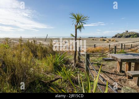 Picnic table and bench near Sumner Beach Christchurch New Zealand Stock Photo