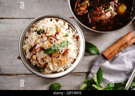 Malabar Ghee Rice or Nei choru with chicken curry, selective focus Stock Photo