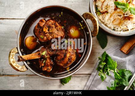 Malabar Chicken curry served with ghee rice or Nei choru, selective focus Stock Photo