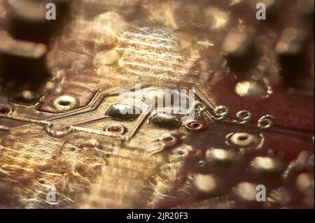 electronic background: Internal components of a printed circuit with solders and various components. Stock Photo